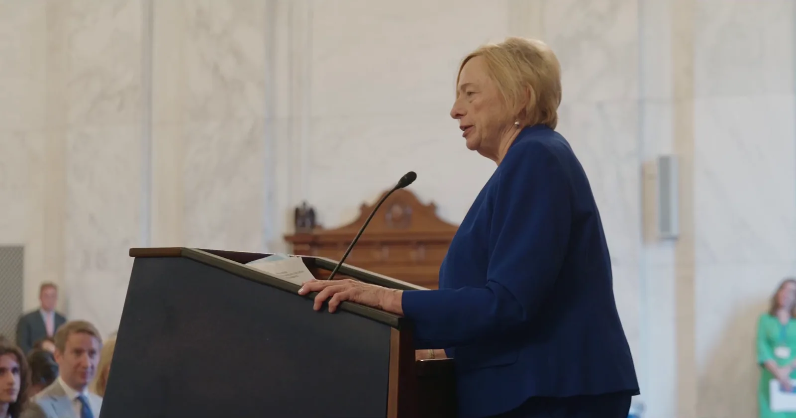 Speaker at the podium in a U.S. Senate hearing room during the 2025 Robert F. Kennedy Human Rights Award Ceremony